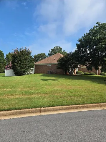 a view of a golf course with a yard