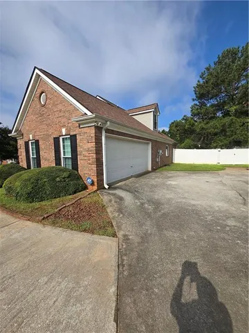 a view of outdoor space and front view of a house