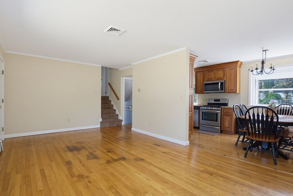 433 Pearse Road Swansea, MA 02777 - Photo 15 of 40 a view of kitchen with furniture and wooden floor