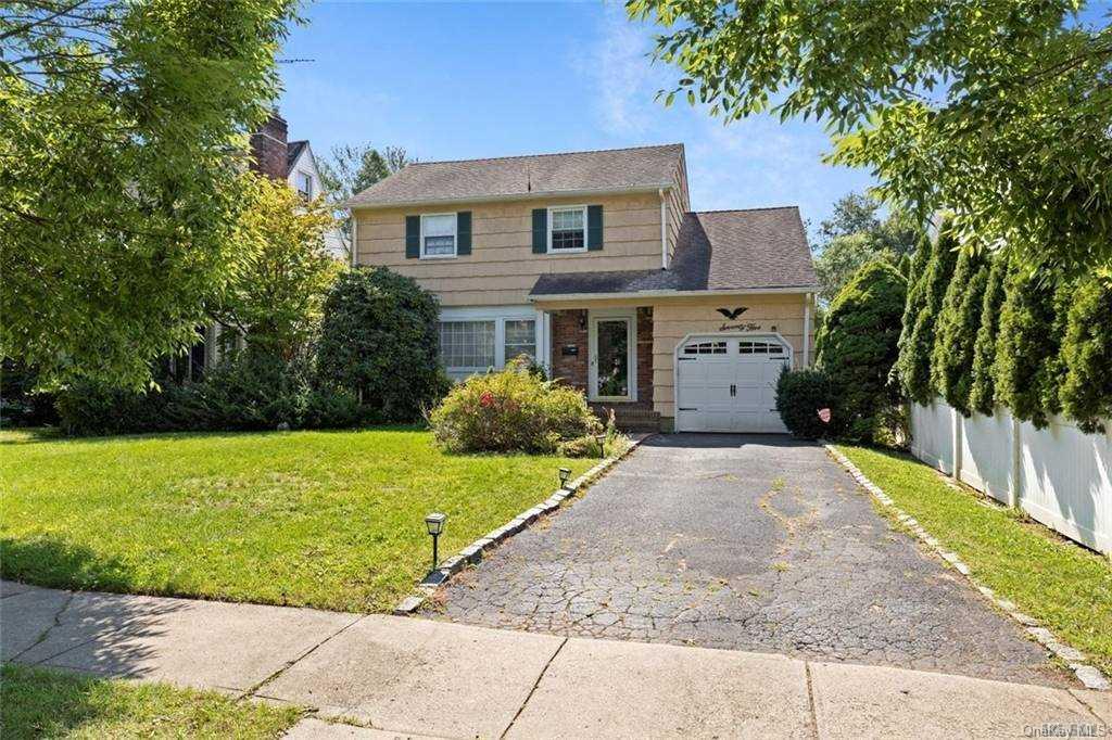 75 Meadowbrook Road Syosset, NY 11791 - Photo 1 of 1 a front view of a house with a yard
