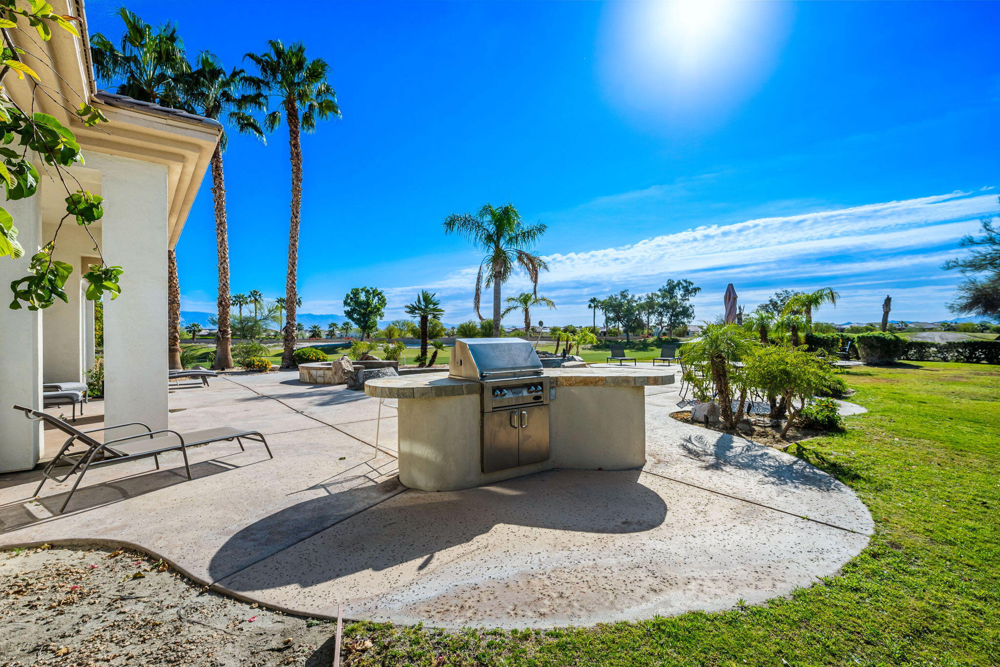 46 Vía Bella Rancho Mirage, CA 92270 - Photo 24 of 28 a view of a swimming pool with outdoor seating