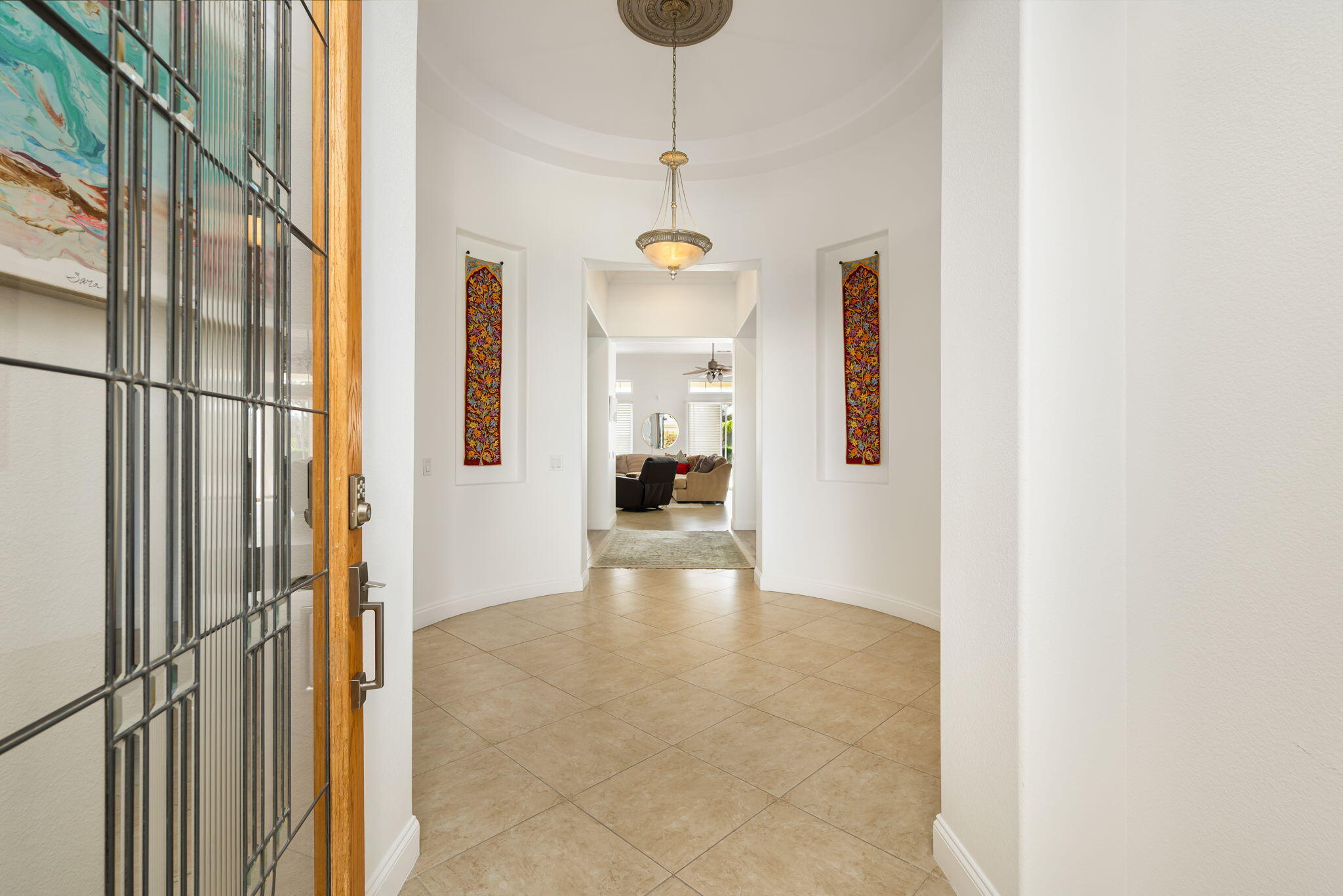 46 Vía Bella Rancho Mirage, CA 92270 - Photo 4 of 28 a view of a hallway view with wooden floor and a dining table