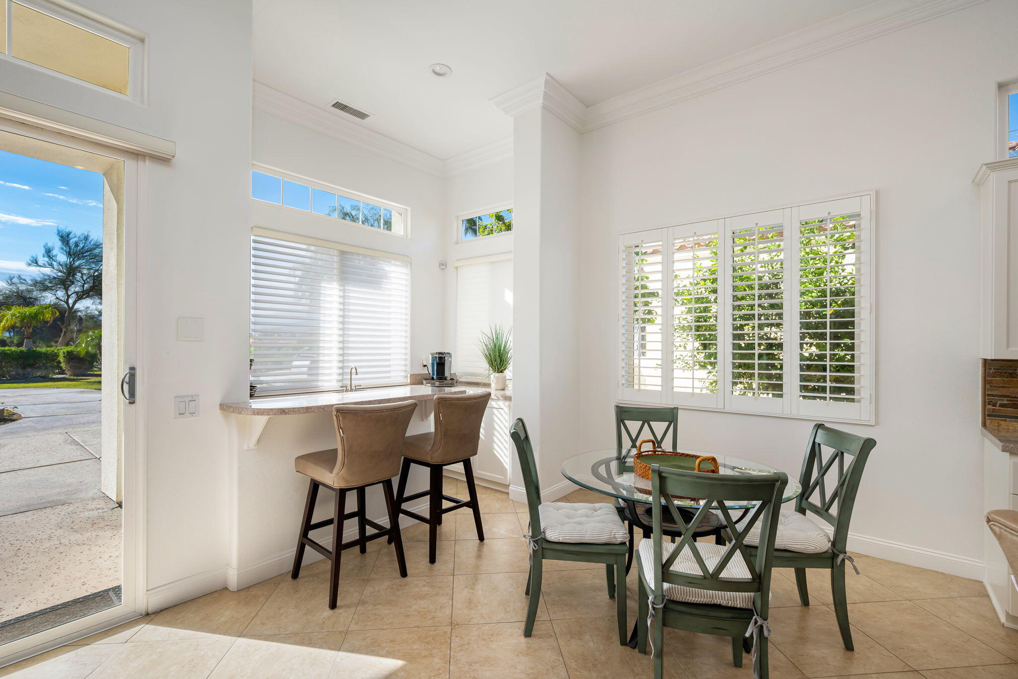 46 Vía Bella Rancho Mirage, CA 92270 - Photo 7 of 28 a view of a dining room with furniture and window