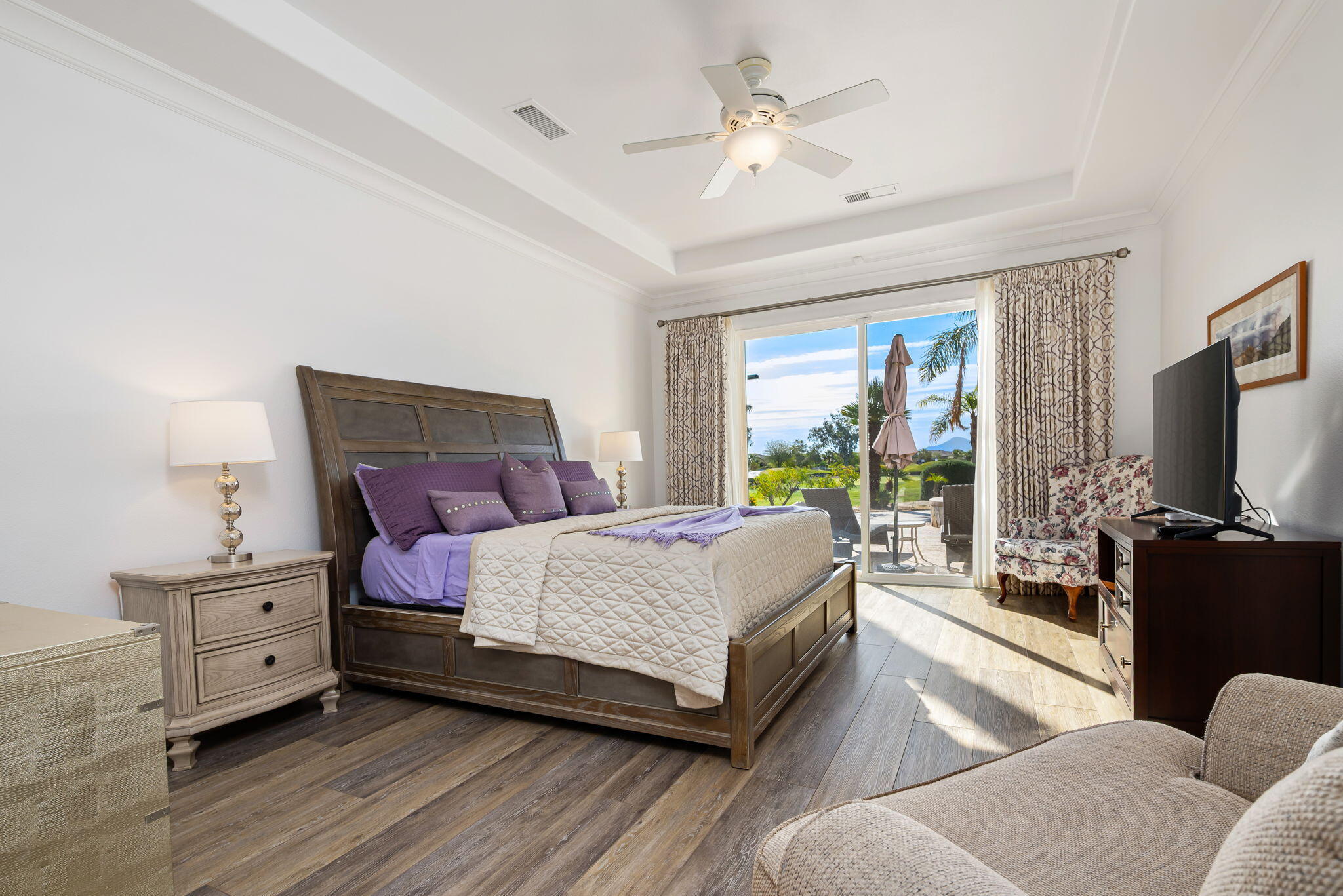 46 Vía Bella Rancho Mirage, CA 92270 - Photo 10 of 28 a bedroom with a bed and a flat tv screen on dresser