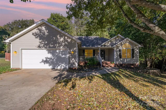 a front view of house with yard outdoor seating and barbeque oven