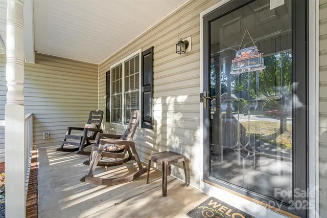 a front view of house with yard outdoor seating and green space