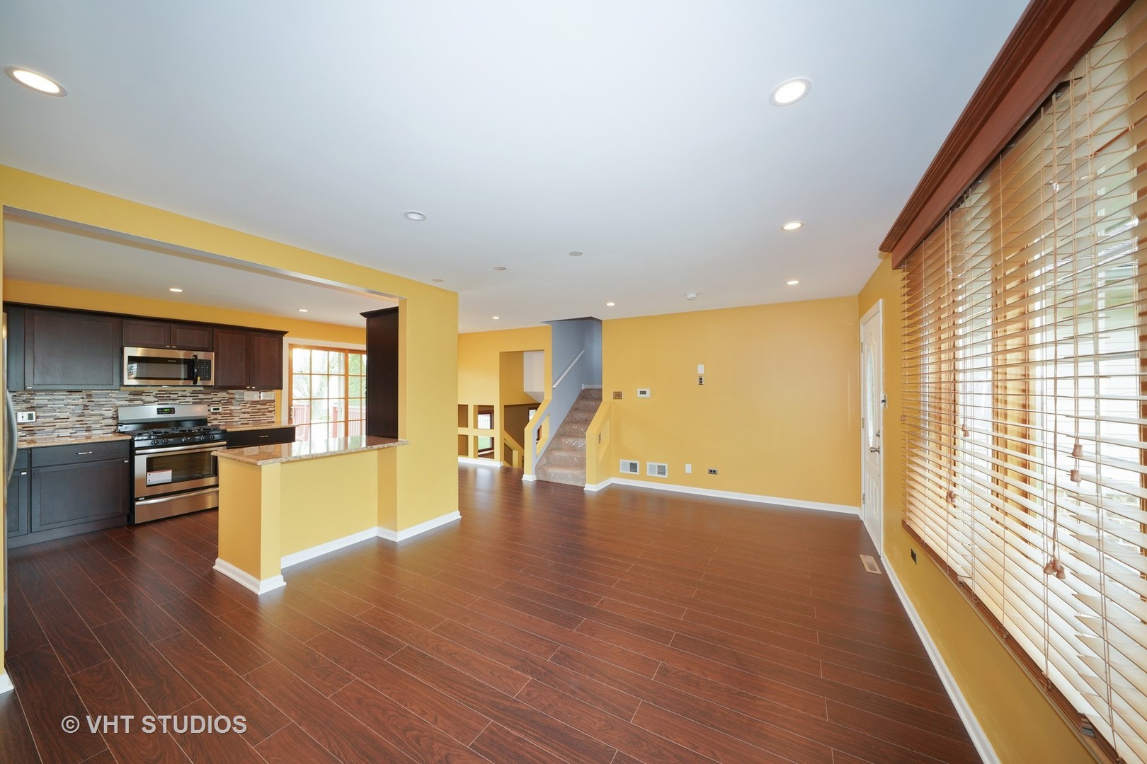 904 Knollside Road New Lenox, IL 60451 - Photo 15 of 16 a view of a kitchen with a stove wooden cabinets and wooden floor
