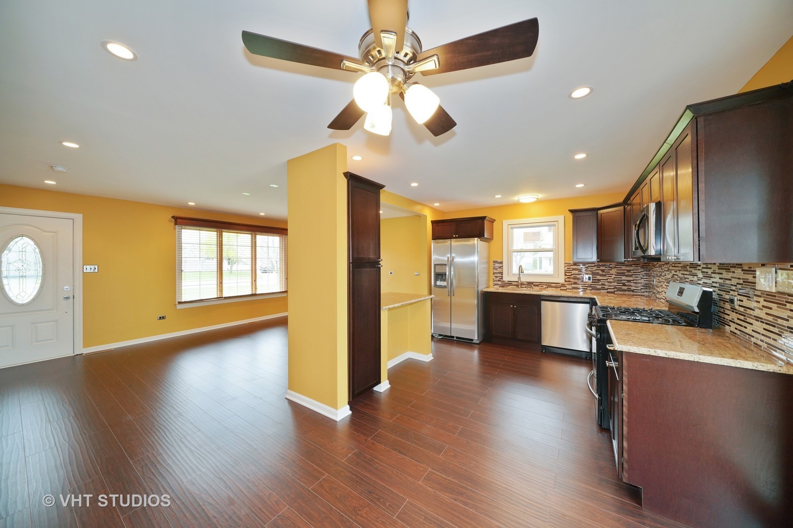 904 Knollside Road New Lenox, IL 60451 - Photo 16 of 16 a open kitchen with stainless steel appliances granite countertop a dishwasher a stove and a wooden floor