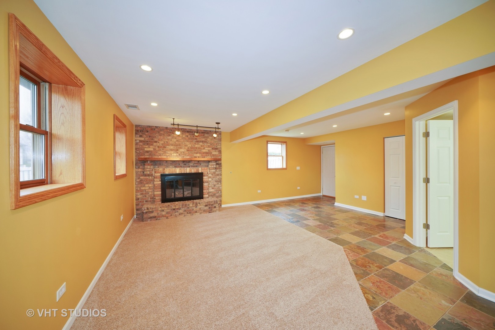 904 Knollside Road New Lenox, IL 60451 - Photo 3 of 16 a view of an empty room with a fireplace and a window