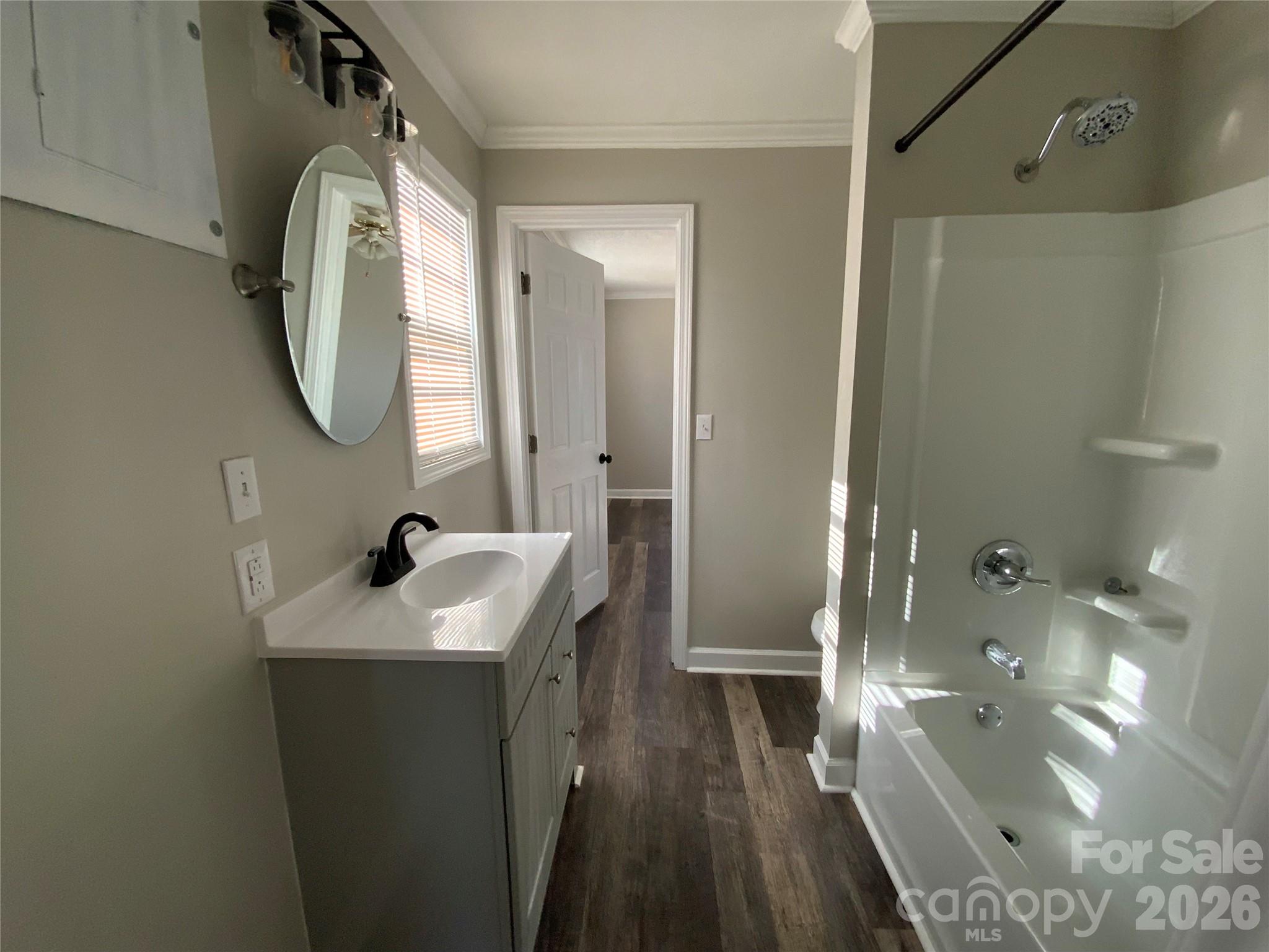 109 Fish Camp Road Forest City, NC 28043 - Photo 5 of 11 a bathroom with a sink a toilet and a mirror