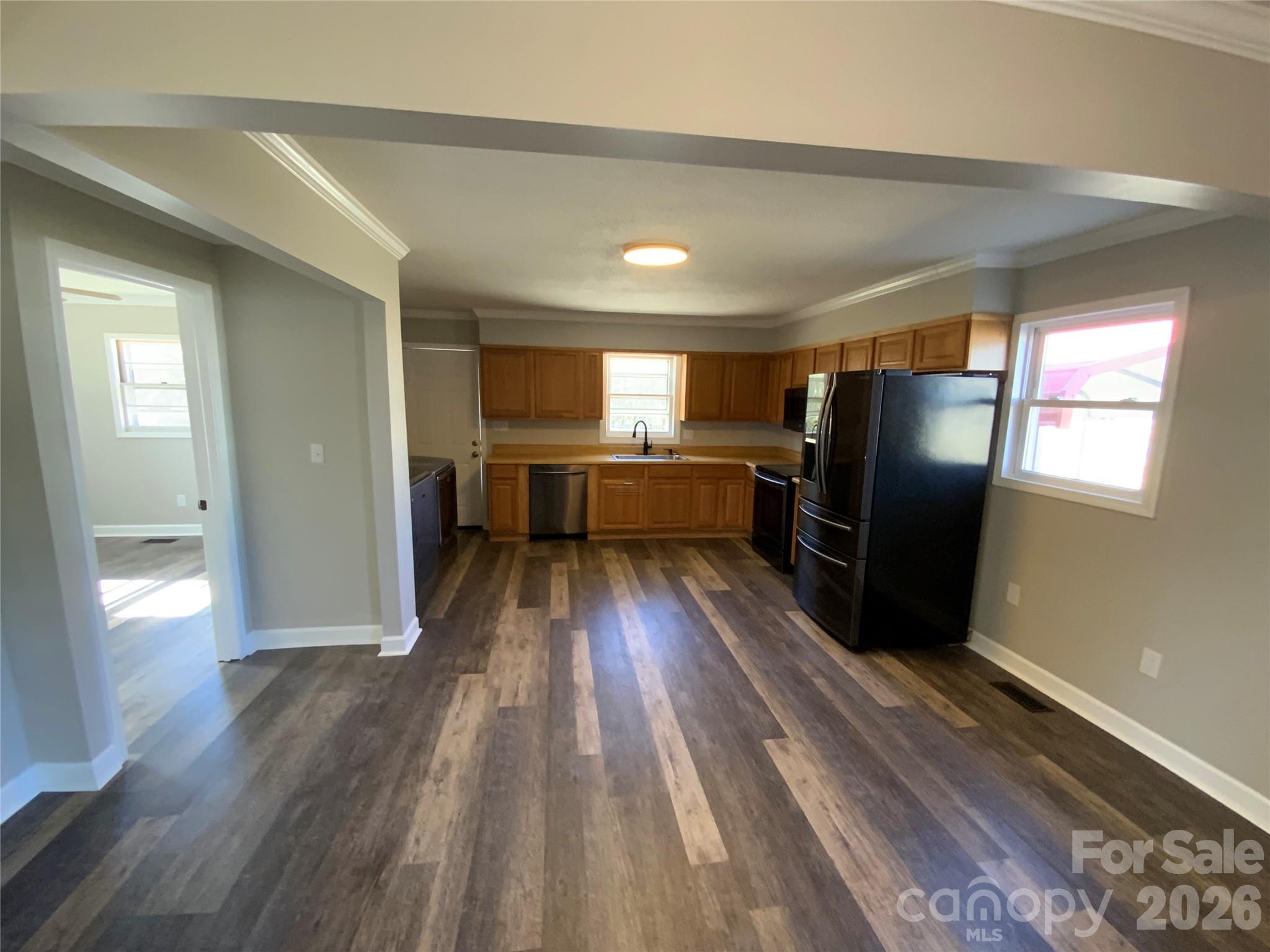 109 Fish Camp Road Forest City, NC 28043 - Photo 10 of 11 a view of a refrigerator in kitchen and wooden floor