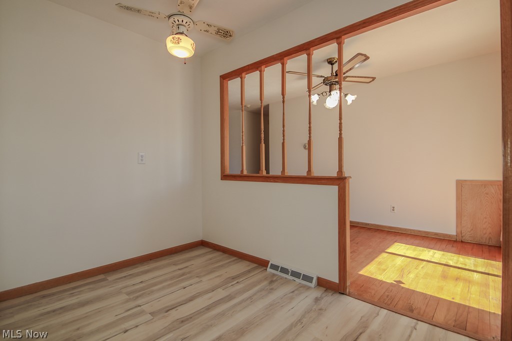 30224 Regent Road Wickliffe, OH 44092 - Photo 7 of 27 Unfurnished room featuring light wood finished floors and ceiling fan