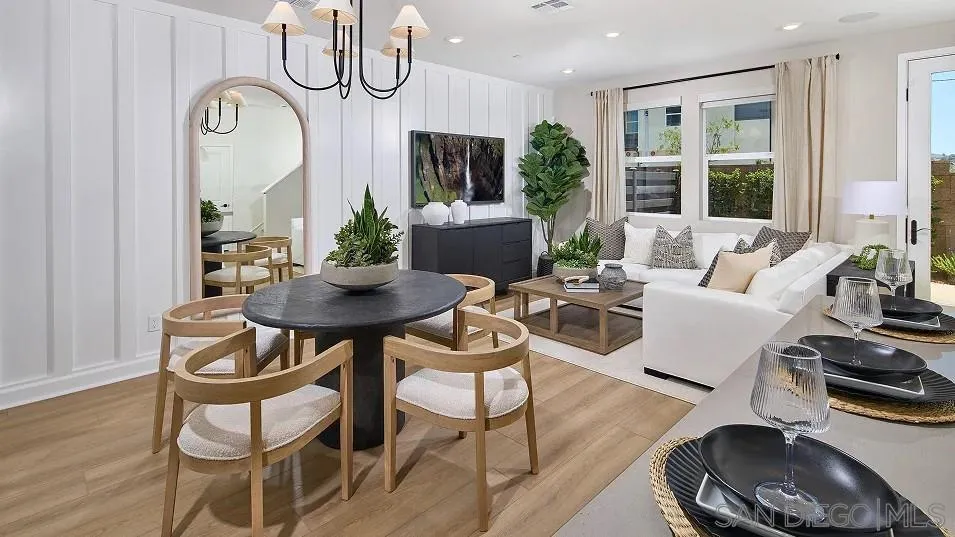 324 Beaker Road San Marcos, CA 92078 - Photo 5 of 19 a living room with furniture a large window and a chandelier