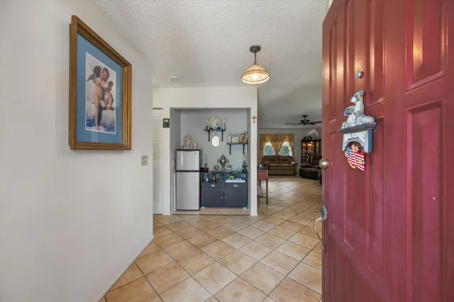 a view of a hallway with a furniture and entryway