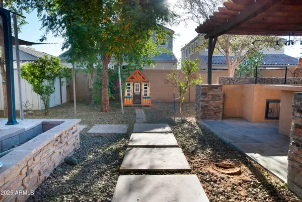 a view of a backyard with sitting area