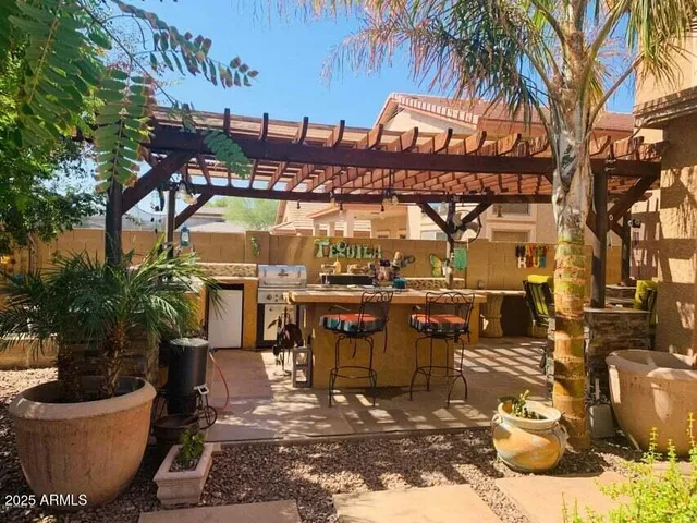 a view of a swimming pool with an outdoor seating