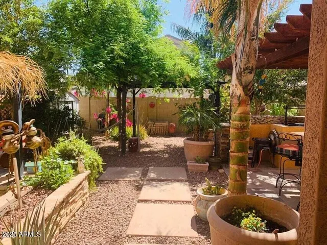 a view of a backyard with sitting area