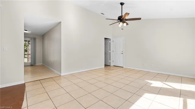 a view of a room with a projector and fan