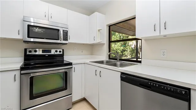 a kitchen with a stove and a microwave