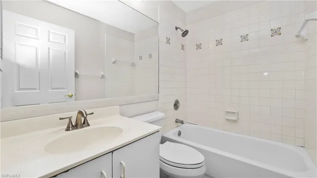 a bathroom with a sink a toilet and a bathtub