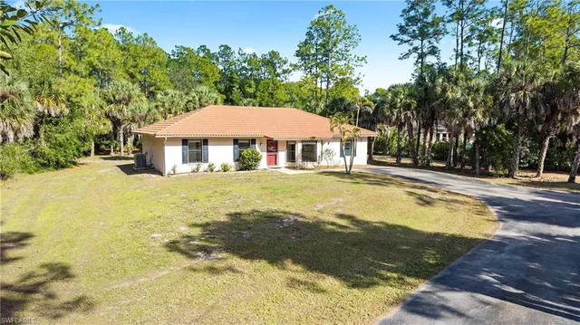a house with swimming pool in front of it