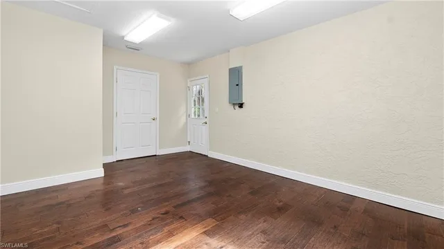 an empty room with wooden floor