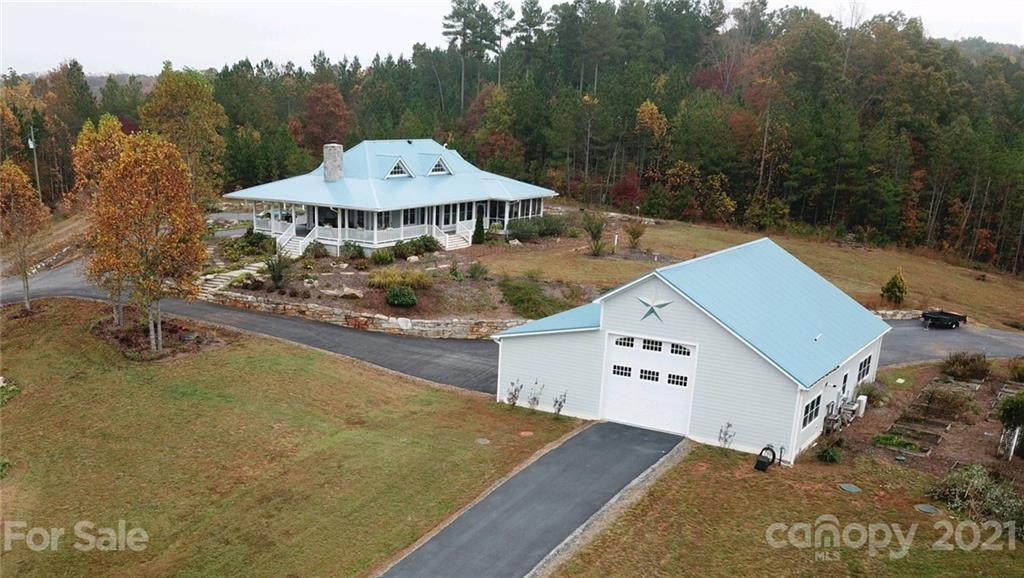 95 Pilot Ridge Road, Unit 21 Nebo, NC 28761 - Photo 23 of 32 a aerial view of a house with yard and mountain view