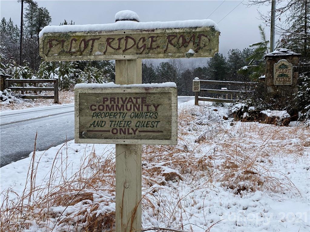 95 Pilot Ridge Road, Unit 21 Nebo, NC 28761 - Photo 7 of 32 a sign on the side of a road