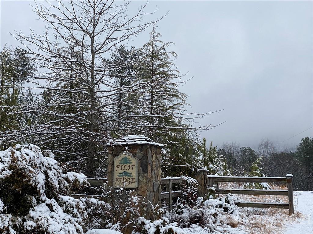 95 Pilot Ridge Road, Unit 21 Nebo, NC 28761 - Photo 8 of 32 a bench sitting in the middle of a forest