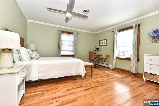 a bed room with a bed and a chair