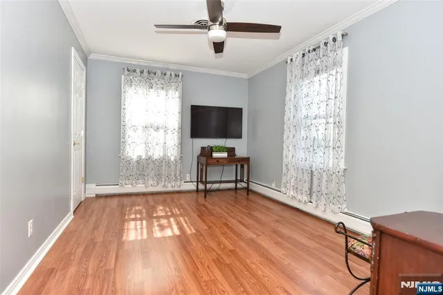 a view of a bedroom with washer and dryer