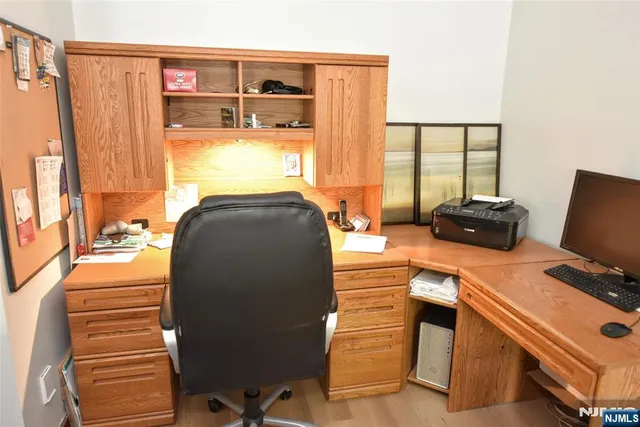 a view of a dining room with furniture wooden floor and chandelier