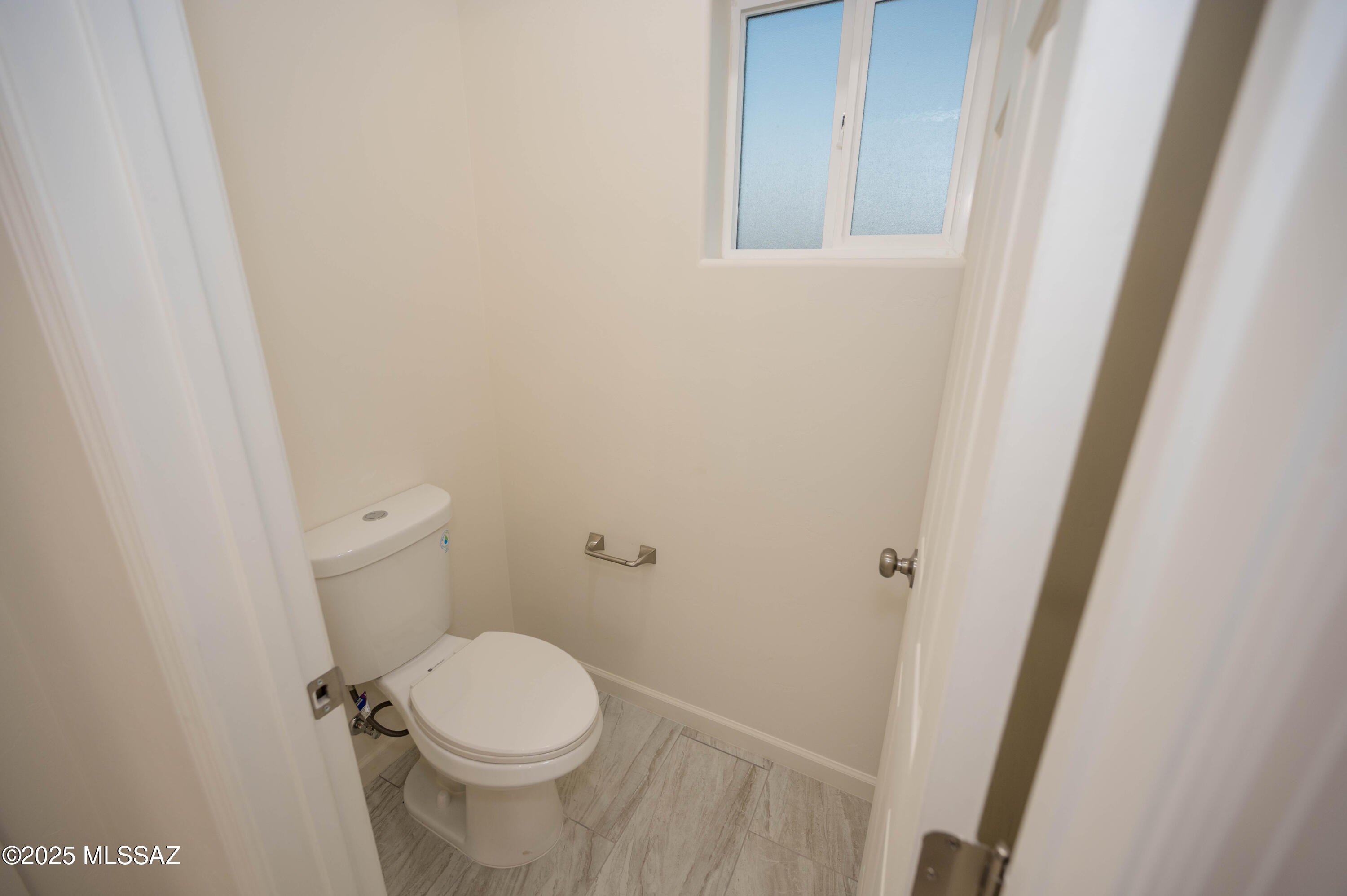 497 Calle Cipres Rio Rico, AZ 85648 - Photo 48 of 50 a white toilet sitting next to a white sink