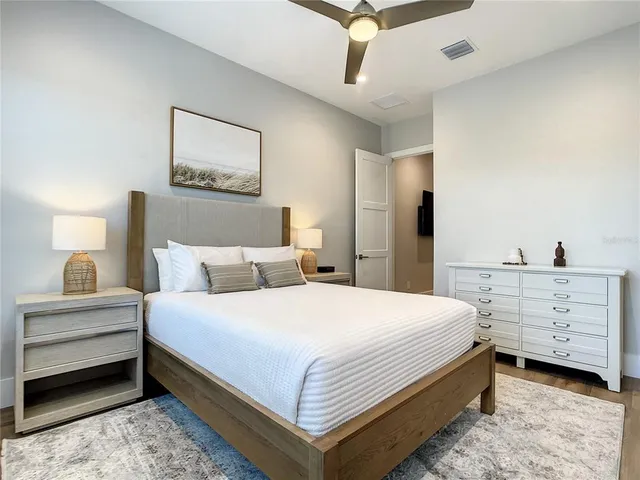 a bedroom with a bed and a dresser