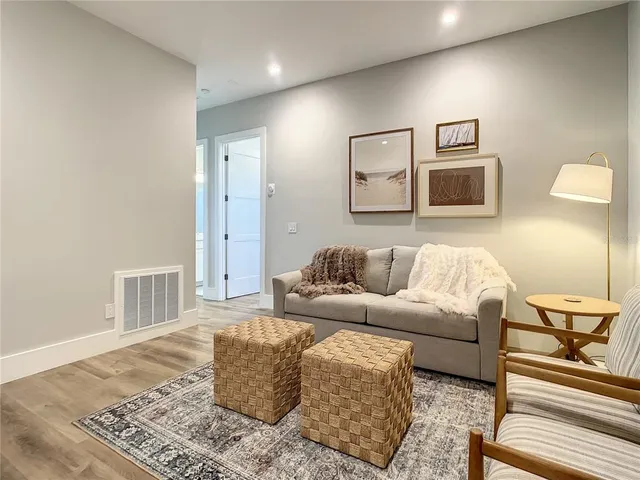 a living room with furniture and a rug