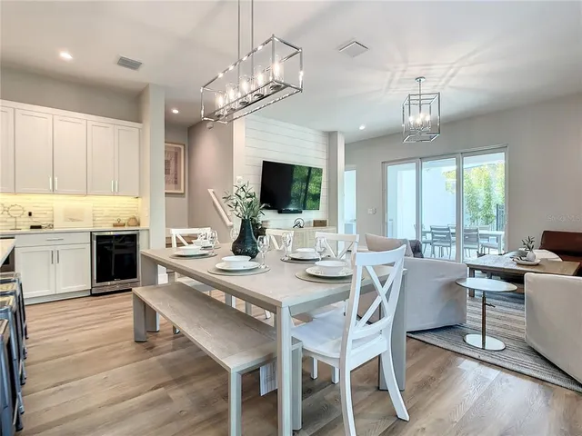 a view of a dining room with furniture window and wooden floor