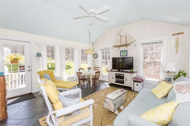 140 Warren Street Upton, MA 01568 - Photo 12 of 37 a living room with furniture flat screen tv and a fireplace