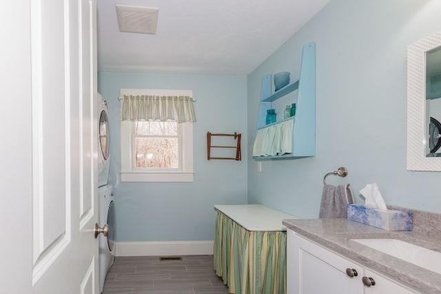 140 Warren Street Upton, MA 01568 - Photo 15 of 37 a bathroom with a granite countertop sink a vanity and a window