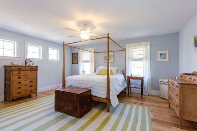 140 Warren Street Upton, MA 01568 - Photo 18 of 37 a bedroom with a bed and wooden floor