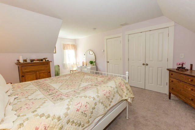140 Warren Street Upton, MA 01568 - Photo 24 of 37 a spacious bedroom with a bed and dresser