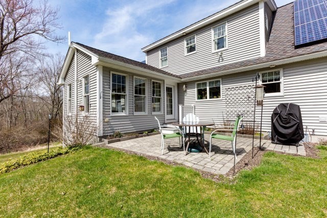 140 Warren Street Upton, MA 01568 - Photo 28 of 37 a backyard of a house with table and chairs