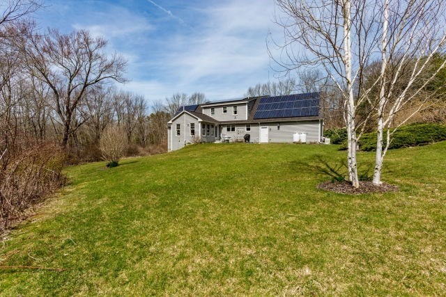 140 Warren Street Upton, MA 01568 - Photo 31 of 37 a view of a house with a big yard and large tree
