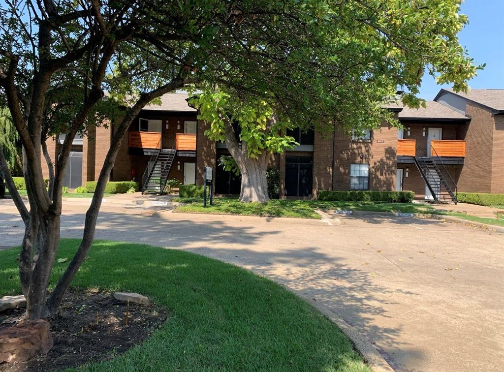 4412 Chaha Road, Unit 106 Garland, TX 75043 - Photo 4 of 4 a view of a house with a yard and tree s