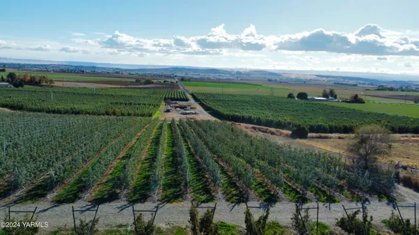 an aerial view of a house with a lake view