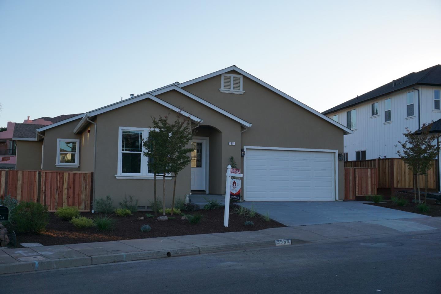3952 Millbrook Drive Santa Rosa, CA 95404 - Photo 1 of 11 a front view of a house with garage
