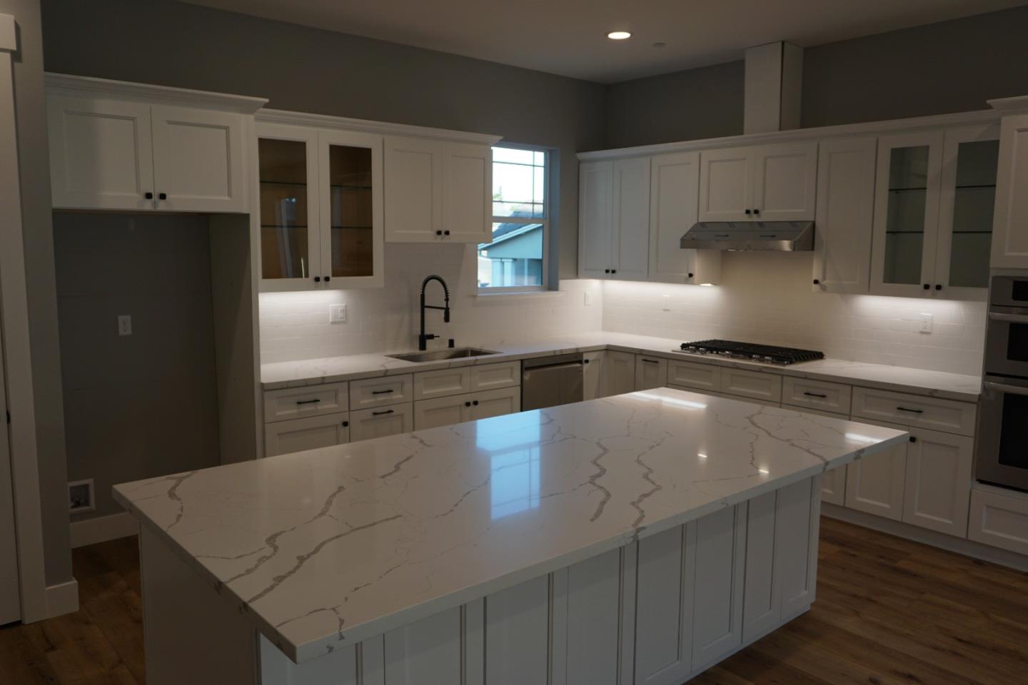 3952 Millbrook Drive Santa Rosa, CA 95404 - Photo 4 of 11 a kitchen with stainless steel appliances granite countertop a sink stove and refrigerator