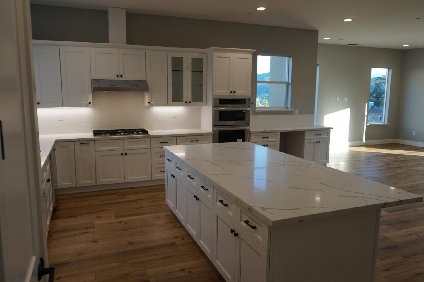 3952 Millbrook Drive Santa Rosa, CA 95404 - Photo 5 of 11 a kitchen with stainless steel appliances granite countertop a sink and a stove