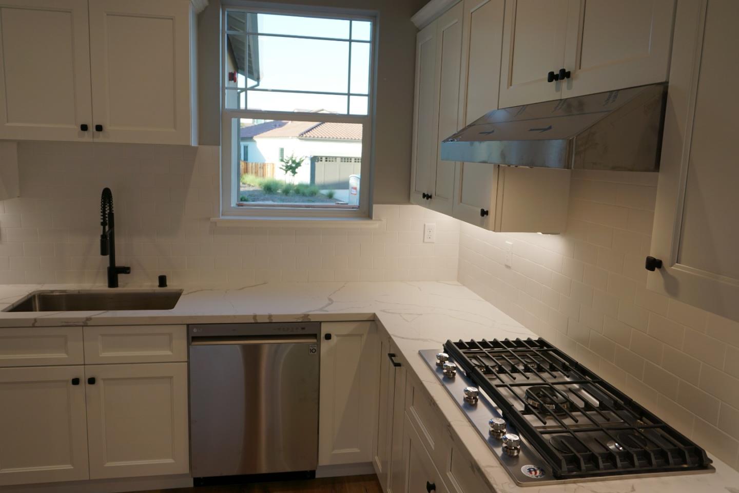 3952 Millbrook Drive Santa Rosa, CA 95404 - Photo 6 of 11 a kitchen with wooden cabinets and a stove top oven