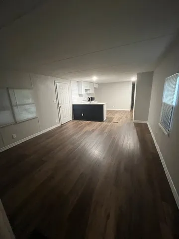 a view of a livingroom with wooden floor