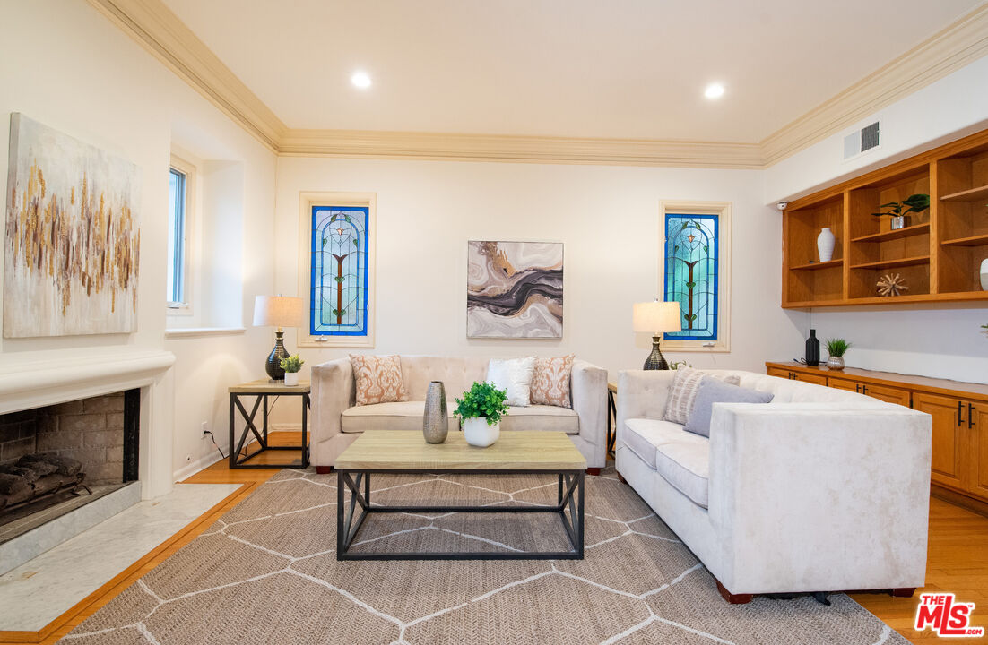 115 Roma Court Marina del Rey, CA 90292 - Photo 17 of 50 a living room with furniture and a fireplace